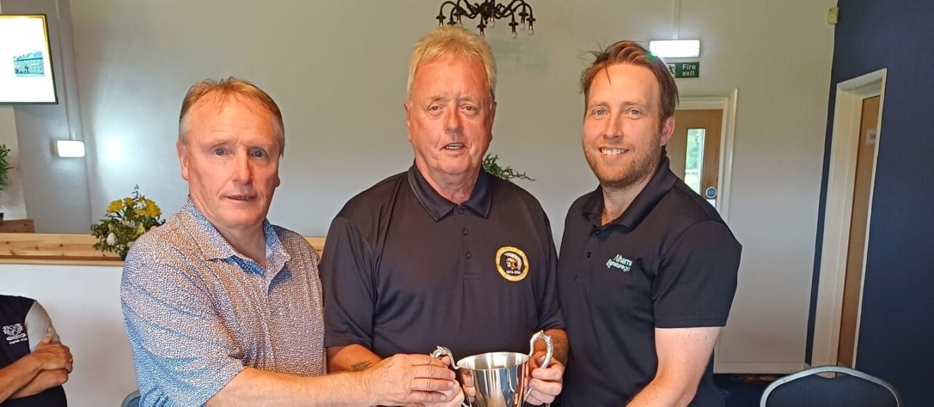 Prudhoe receiving the trophy