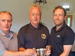 Prudhoe receiving the trophy