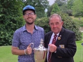 James Glenn receiving the trophy