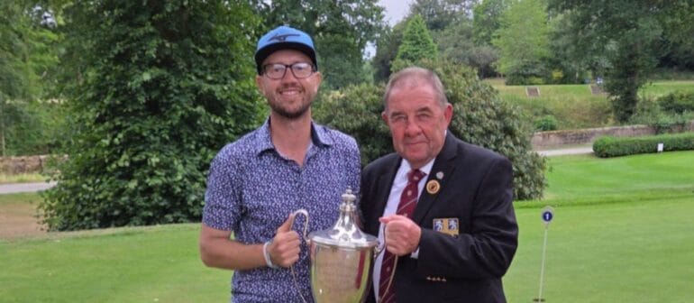 James Glenn receiving the trophy