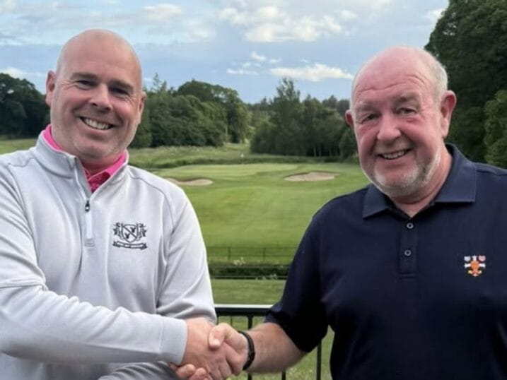 John Harrison receiving the winner's cheque