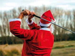 Santa playing golf