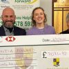 Scott Gray (left) and Rachel Holden (right) presenting the cheque