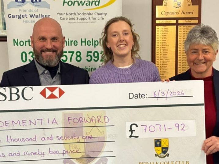 Scott Gray (left) and Rachel Holden (right) presenting the cheque
