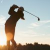 Golfer at sunset
