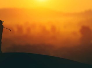 Golfer at sunset