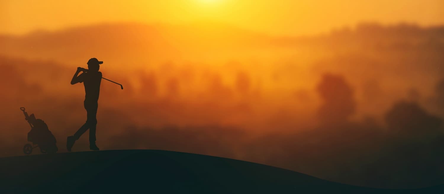 Golfer at sunset