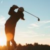 Junior golfer at sunset