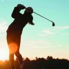 Golfer sunset