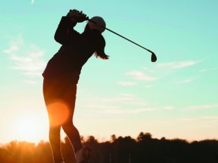 Golfer sunset