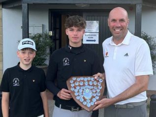 Myles and Hugo Bowey-Taylor receiving the trophy from NUGC executive member Michael Wilson
