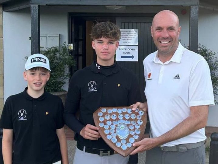 Myles and Hugo Bowey-Taylor receiving the trophy from NUGC executive member Michael Wilson