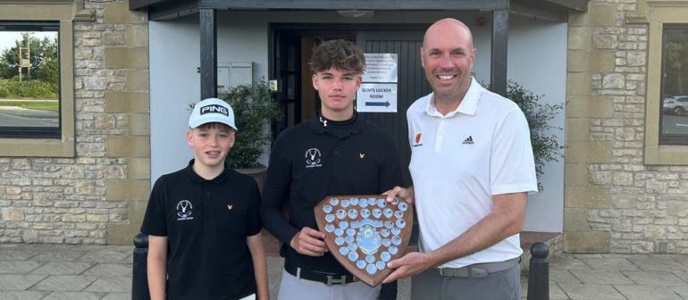 Myles and Hugo Bowey-Taylor receiving the trophy from NUGC executive member Michael Wilson